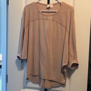 Wing arm tan shirt from Francesca’s. Size medium